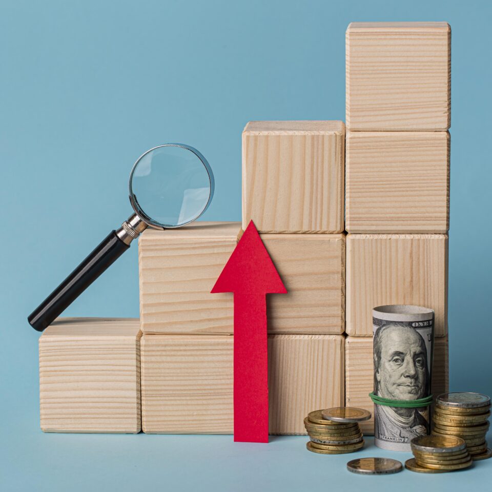 wooden-blocks-with-magnifying-glass-growth-arrow